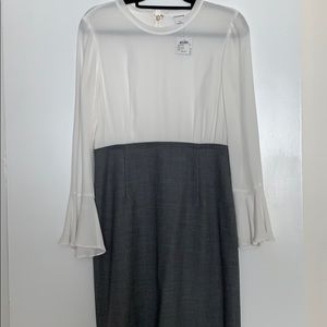 Sheer top dress with grey wool skirt